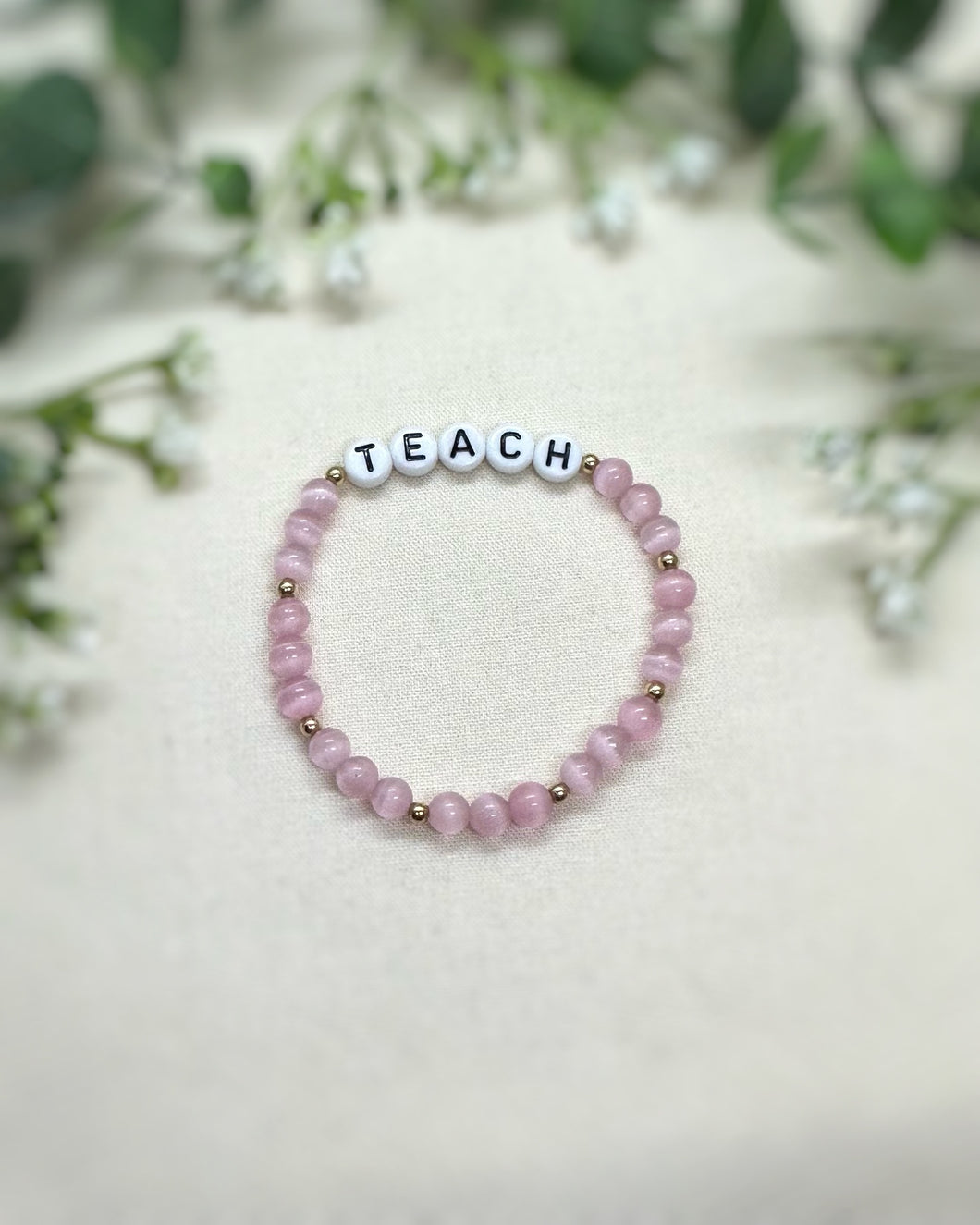 TEACH pink cateye and gold pre-made bracelet